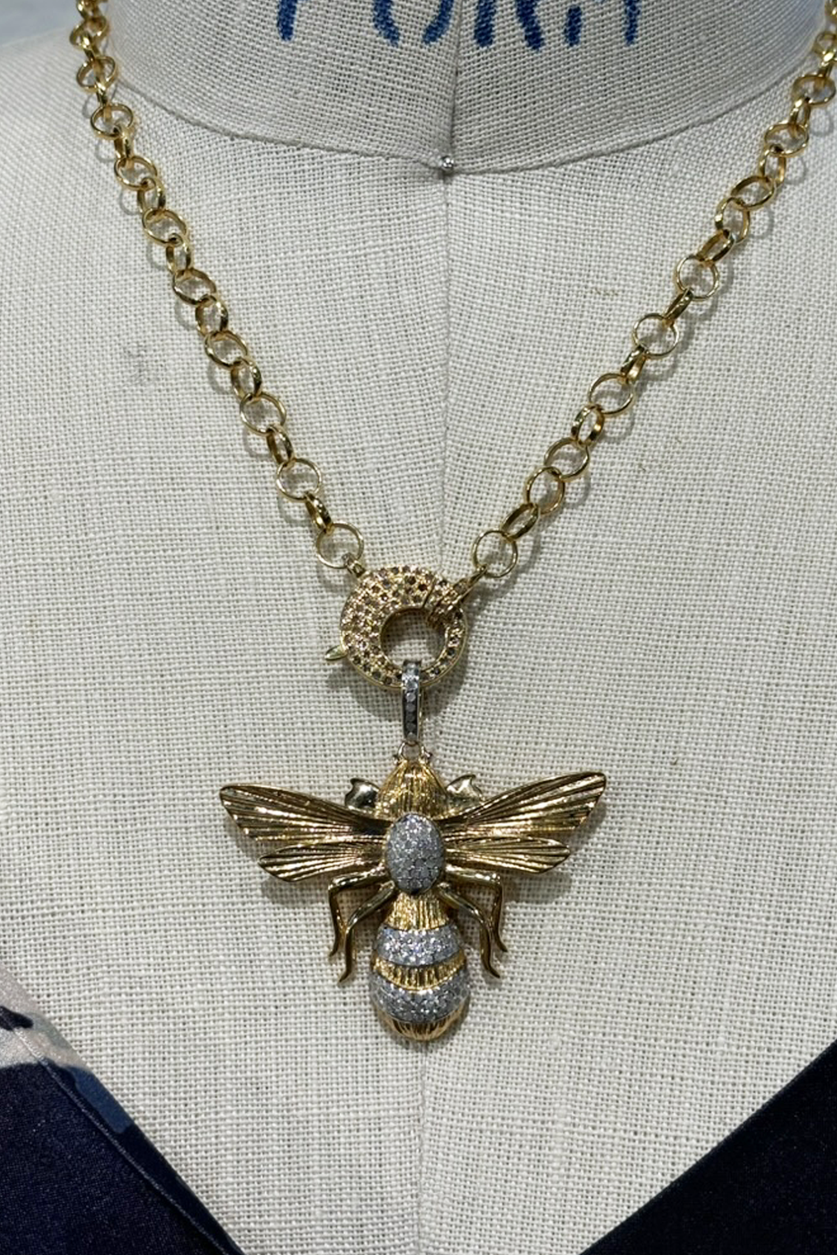 gold and diamond bee pendant