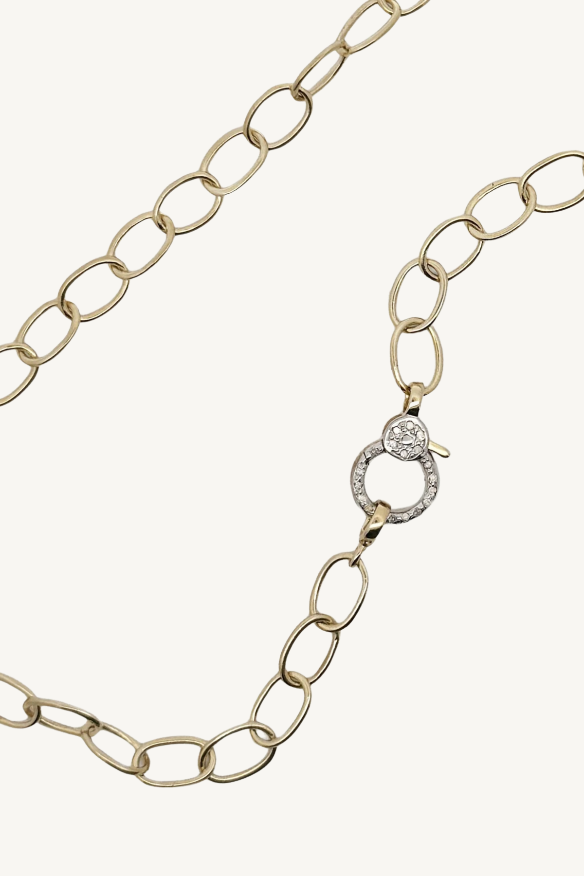 small oval link chain with pave diamond round clasp