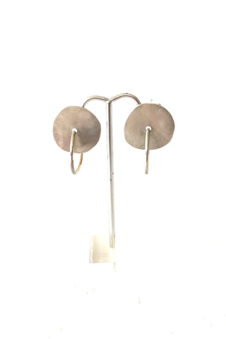 silver disc with hoop earrings