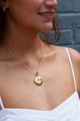 gold sunburst locket