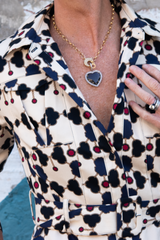 borgo de nor shirt dress with the woods fine jewelry 22k gold over brass circle chain with pave and baguette diamond heart shaped pendant on a model for scale