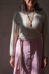 Xirena Spence Skirt Petal Pink The Woods Fine Jewelry Peach Moonstone Pendant and 22k Gold Chain on Nili Lotan Alise Sweater in Cream Knit
