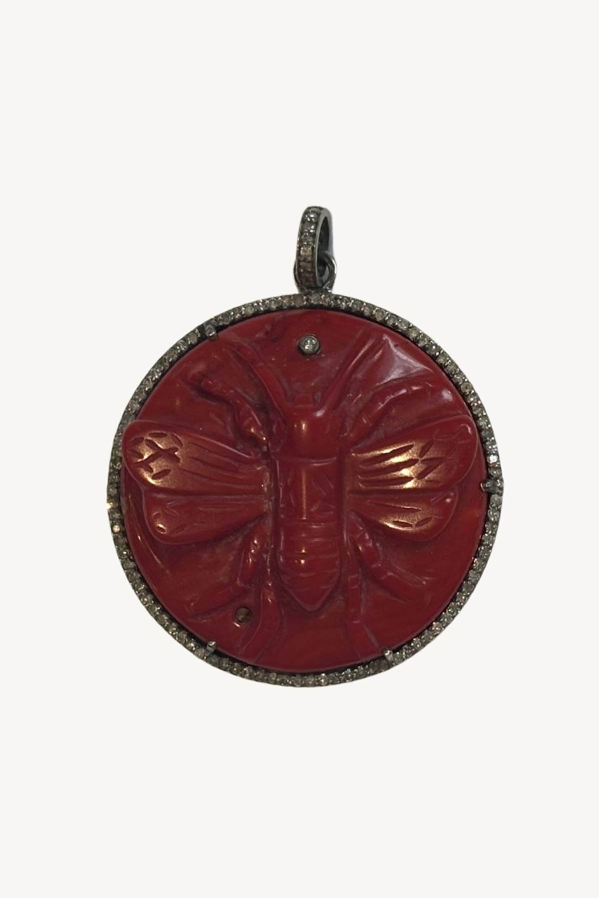 carved bee pendant